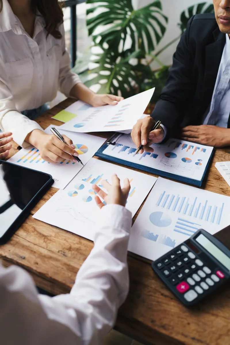 OZMO advisers collaborating at a desk