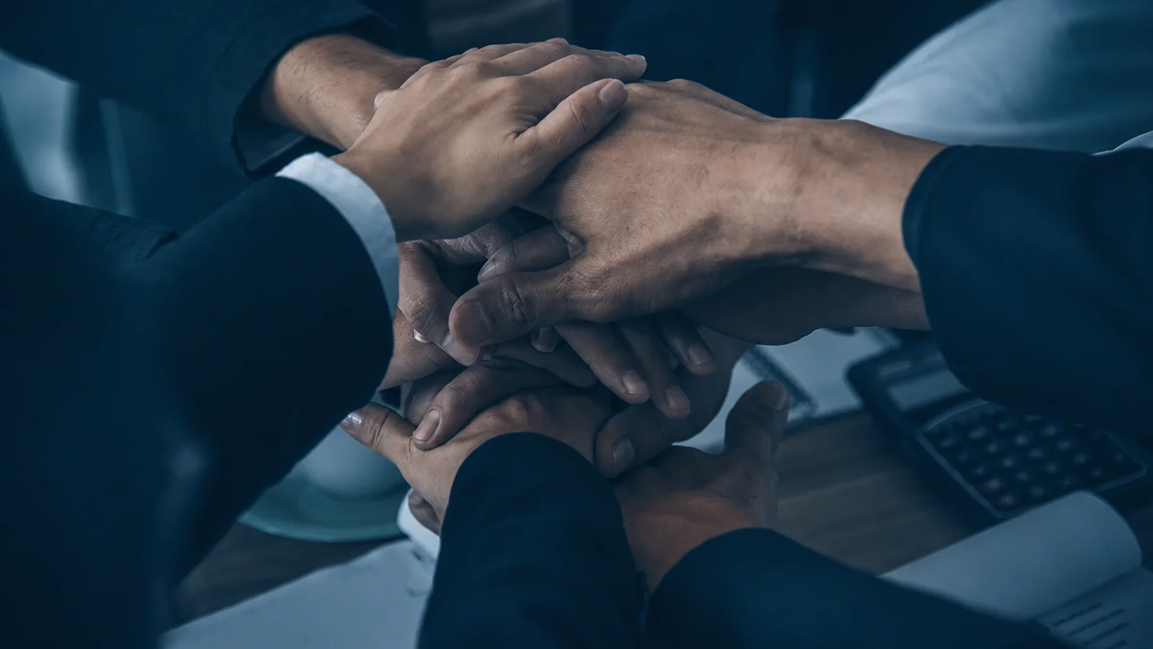 The team joining hands