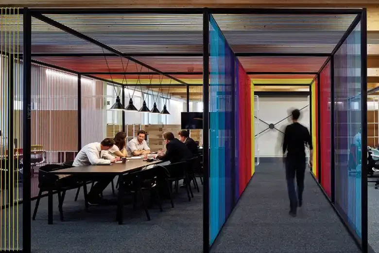 Glass meeting rooms and office corridor
