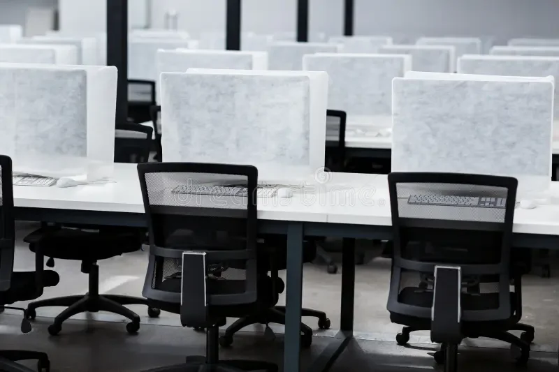 Glass meeting rooms and office corridor