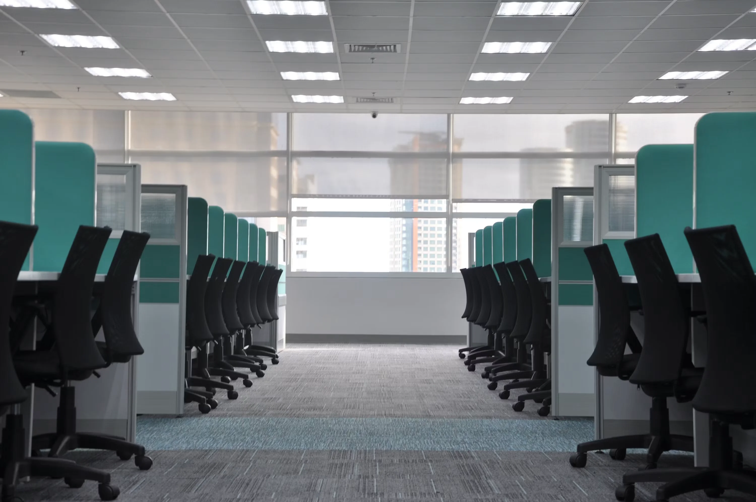 Glass meeting rooms and office corridor